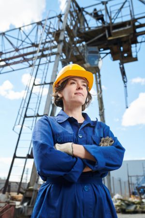 Smiling Woman at Construction Site